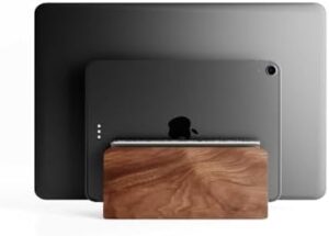 Elevate your workspace with the Raico Vertical Laptop Stand, featuring premium walnut wood and dual slots for Macbook. Perfect for ergonomic computing and desk organization.
