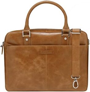 Protect your valuable laptop in style with the Rosenborg 14 inch bag, crafted from genuine full grain leather and featuring textured handles and an adjustable strap. Perfect for daily use.