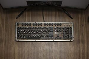 Get ready to take your typing game to the next level with AZIO's retro classic mechanical keyboard. Featuring a vintage look and UK layout, this Bluetooth keyboard is perfect for those seeking a nostalgic typing experience.