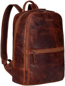 Explore the stylish and functional STILORD 'Kellis' Vintage Leather Backpack, perfect for business school or university. With a genuine leather design, large capacity and 15-inch laptop compartment, stay organized and stylish.