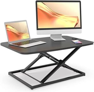 Elevate your workspace with the JOY worker Standing Desk Converter, a compact 31-inch height adjustable stand up desk riser for laptop workstations. Perfect for sit-to-stand desks and ergonomic working.