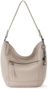 Elevate your daily routine with the Sak Sequoia Hobo Bag, a premium leather handbag featuring a spacious interior, durable construction and secure zipper pocket. Perfect for travel and everyday use. Save big on this stylish purse!